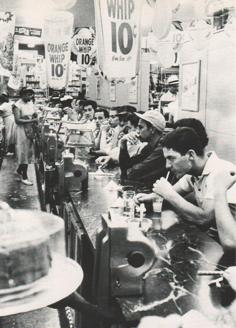 ROBERT FRANK - Drug Store, Detroit: Artist: ROBERT FRANK Print Title: Drug Store, Detroit Printing Date: 1950’s Medium: photoengraving Printed in: the USA Image Size: approx. 6.5 x 5” Reserve: $25.00 Shipping: Domestic: Flat rate of
