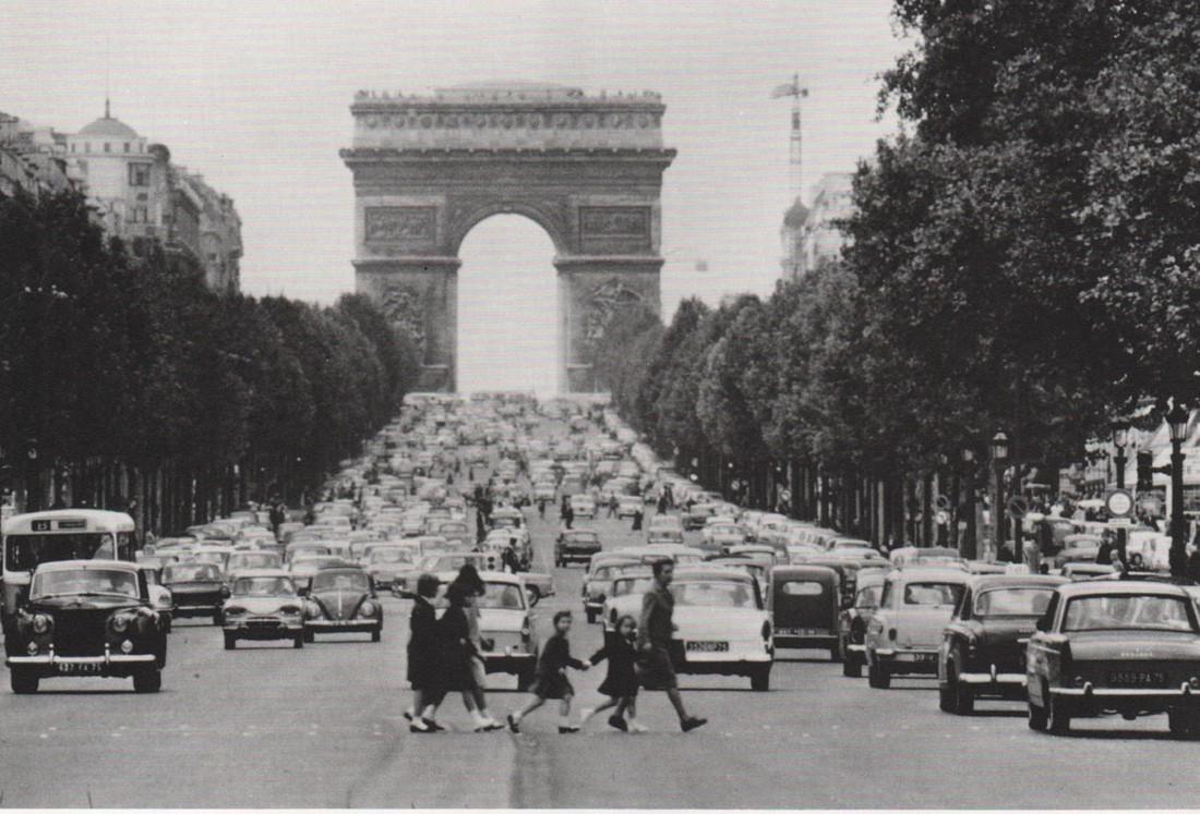KERTESZ - The Champs Elysees, 1963: Artist: KERTESZ Print Title: The Champs Elysees, 1963 Medium: Photoengraving Printed 1970’s in the USA Image size (inches) approx. 5 x 8” Andre Kertesz (1894-1985) born Kertesz Andor, was a Hung