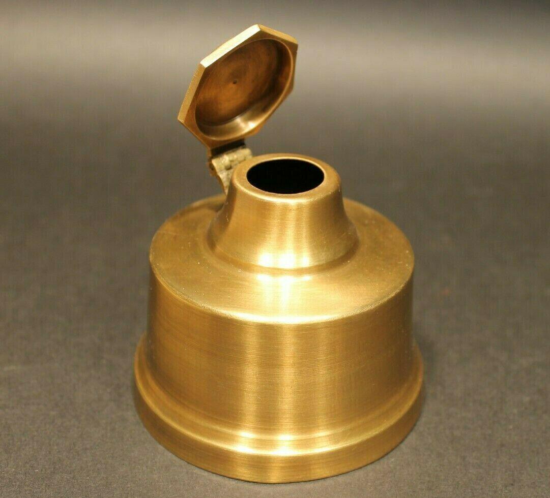 Brass Inkwell Ink pot Bottle: 2 3/4" tall x 3 1/4 wide Nice! reproduction antique brass inkwell. Great wide base to prevent tipping! Solid aged brass with a sturdy hinged lid. Stays open easily when lifted. Great for use or as a h