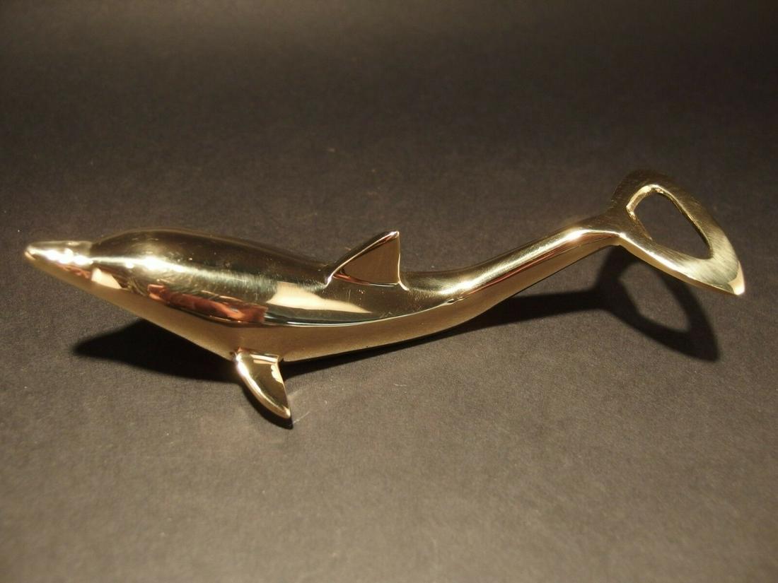 Brass Dolphin Soda Beer Bottle Cap Opener: 6 1/2" Long ..2 1/2" Wide Great reproduction heavy solid brass dolphin bottle opener. This piece was made to look just like an antique, but is actually new. Nicely made all solid brass in the form of 