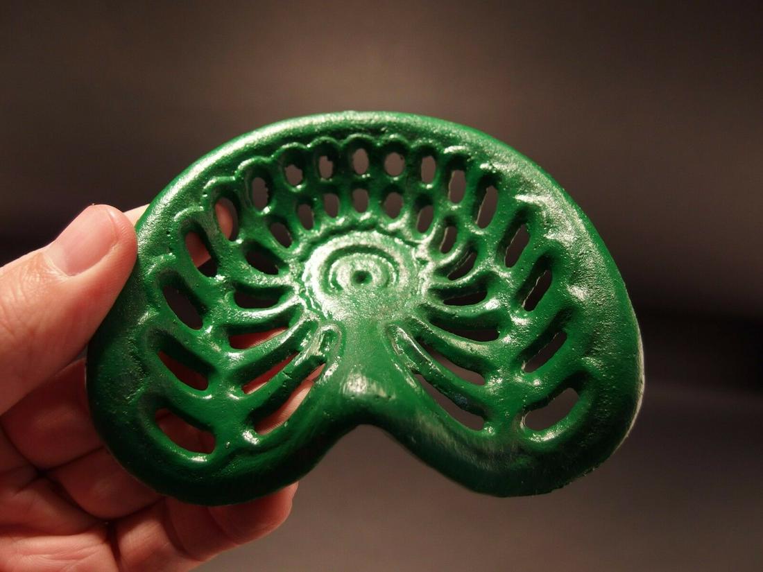 Miniature Green Cast Iron Farm Tractor Seat Paperweight: 4 1/8" x 3 1/2" Great reproduction antique folk art cast iron tractor seat. This piece was cast to look just like the larger version likely as a salesman sample. Makes a great paperweight for any coll