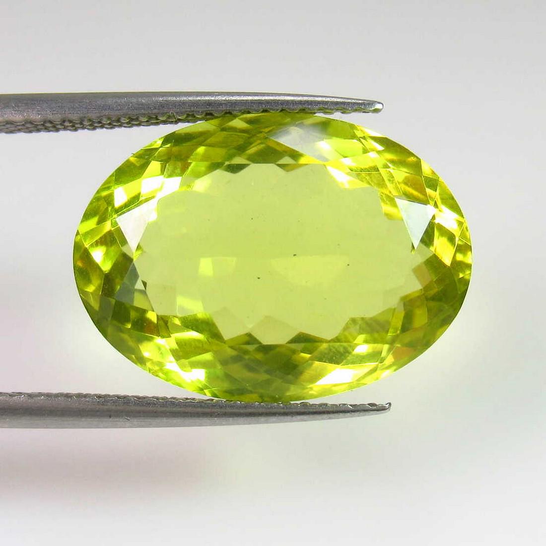 12.29 Ctw Natural Lemon Quartz Oval Cut: Title: 12.29 Ctw Natural Lemon Quartz Oval Cut Stone Clarity: VVS Gemstones: Lemon Quartz Carat Weights: 12.29 Size/Dimensions: 18.00 x 13.20 x 8.20 mm Additional Information: Good Luster / Top Class 