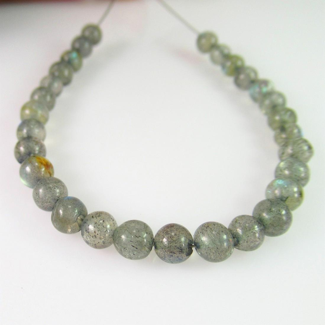 14.76 Ct Genuine 29 Labradorite Drilled Ball Beads: No Reserve! Title: 14.76 Ct Genuine 29 Labradorite Drilled Ball Beads Stone Clarity: Transparent Gemstones: Natural Labradorite Beads Carat Weights: 14.76 Size/Dimensions: 4.20 - 4.60 mm / 29 PC's Add