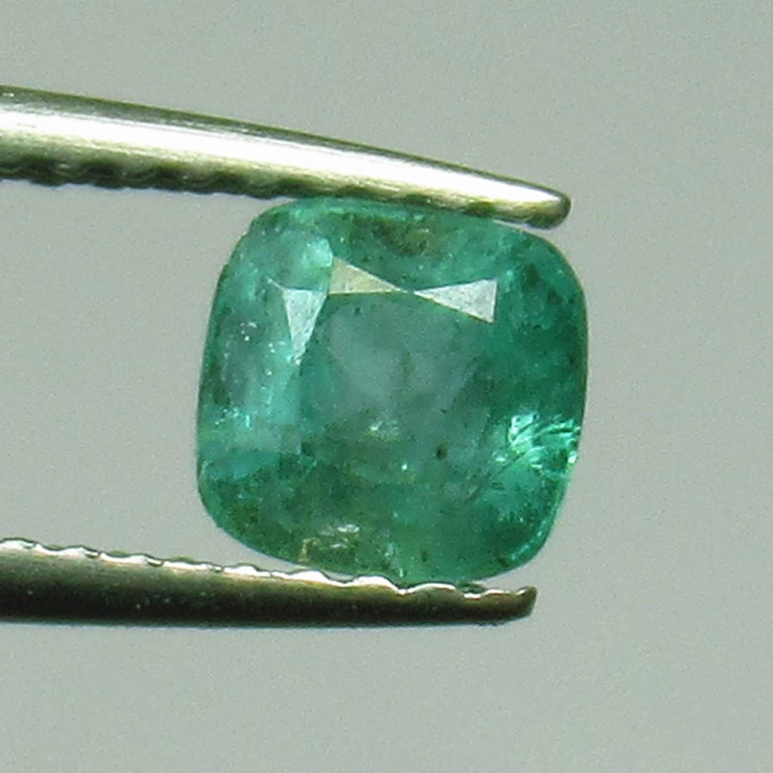 0.74 Ct Genuine Zambian Emerald Cushion Cut: No Reserve! Title: 0.74 Ct Genuine Zambian Emerald Cushion Cut Stone Clarity: SI Gemstones: Natural Emerald Carat Weights: 0.74 Size/Dimensions: 5.20 x 5.00 x 4.40 mm Additional Information: Excellent