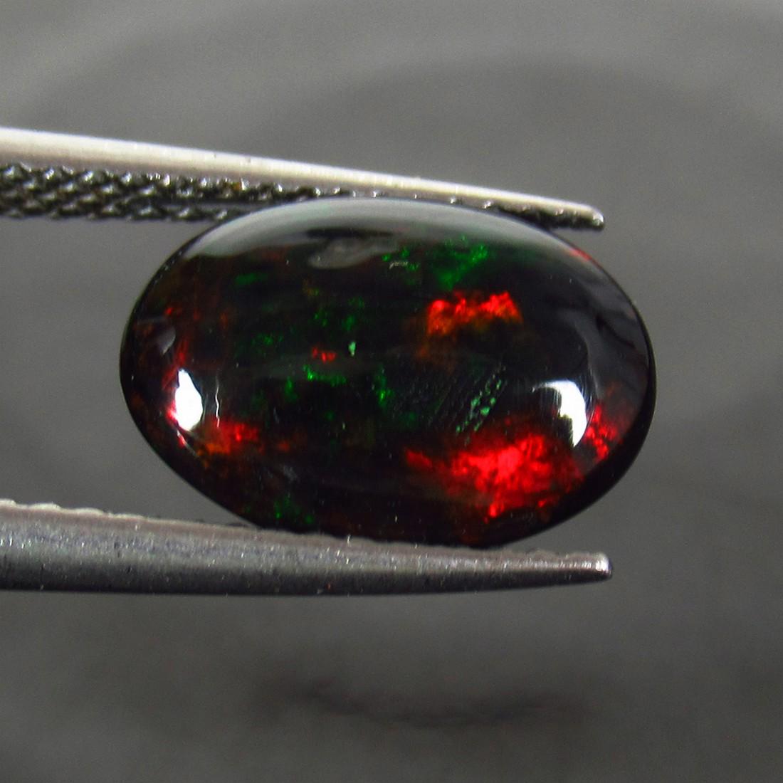 1.91 Ct Genuine Ethiopian Fire Black Opal Oval Cab (1 of 2)