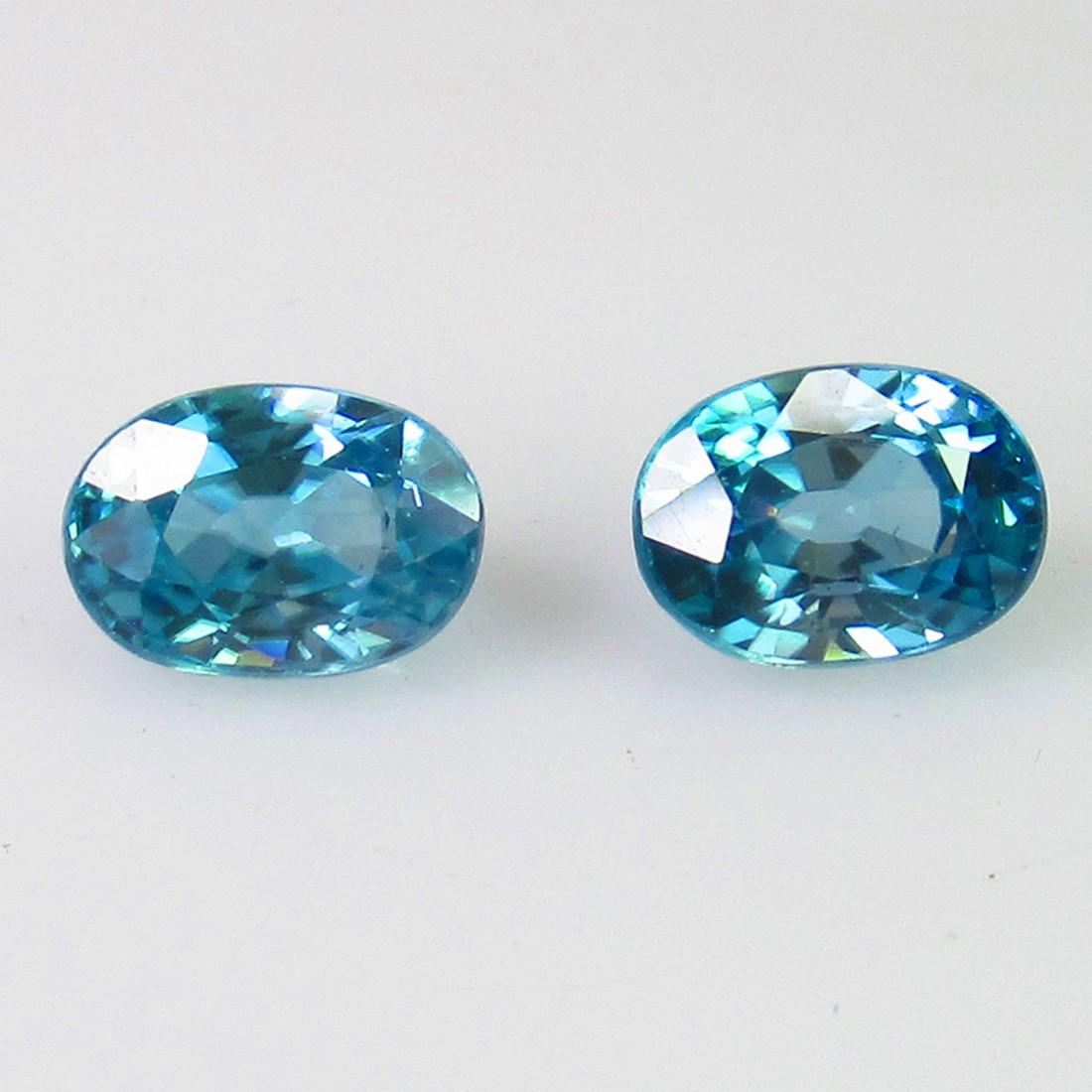 2.91 Ct Genuine Blue Zircon Oval Pair: No Reserve! Title: 2.91 Ct Genuine Blue Zircon Oval Pair Stone Clarity: VVS Gemstones: Natural Zircon Carat Weights: 2.91 Size/Dimensions: 7.00 x 5.10 x 4.00 mm / 2 PC's Additional Information: Top cl