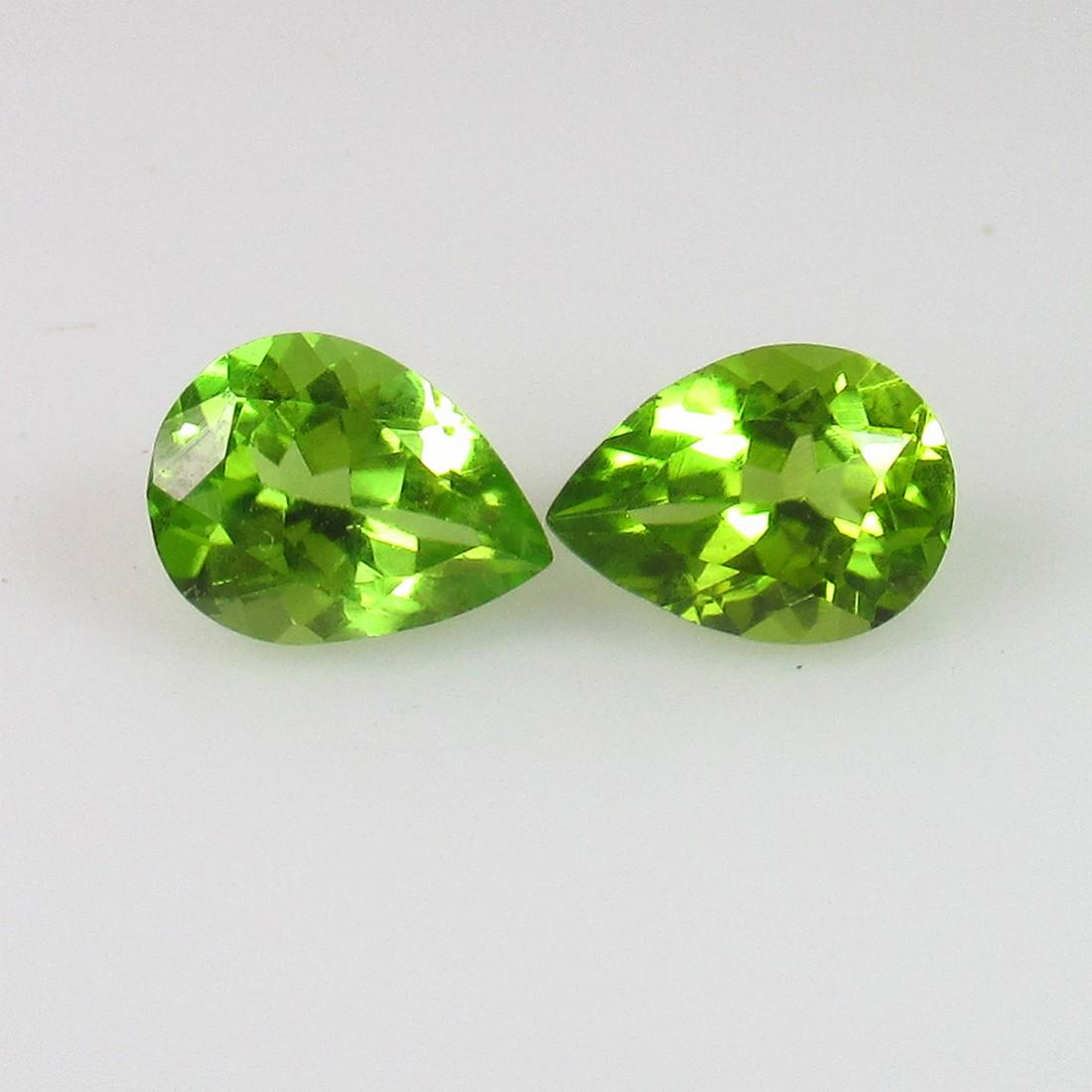2.36 Ct Genuine Pakistan Peridot Pear Pair: No Reserve! Title: 2.36 Ct Genuine Pakistan Peridot Pear Pair Stone Clarity: VVS Gemstones: Natural Peridot Carat Weights: 2.36 Size/Dimensions: 7.90 x 6.00 x 4.10 mm / 2 PC's Additional Information: 