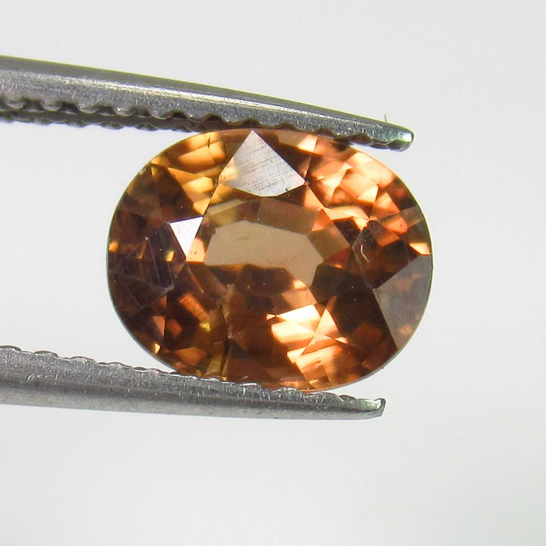 2.05 Ctw Natural Brown Zircon Oval Cut: No Reserve! Title: 2.05 Ctw Natural Brown Zircon Oval Cut Stone Clarity: VVS Gemstones: Zircon Carat Weights: 2.05 Size/Dimensions: 7.60 x 6.20 x 4.30 mm Additional Information: Top Luster / Excellent