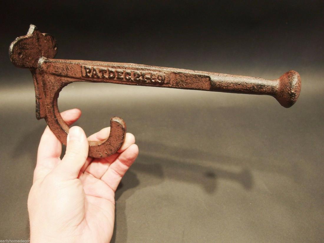 9 1/2" Large Cast Iron Hook Coat Hanger PAT DEC 12-69: 9 1/2" Extension x 2 3/4" Wide 5 1/2" Tall 1 Charming and functional sturdy iron wall hook cast in iron from an antique. Cast hook reads: PAT DEC.21.69 Reserve: $16.00 Shipping: Domestic: Flat-rate of