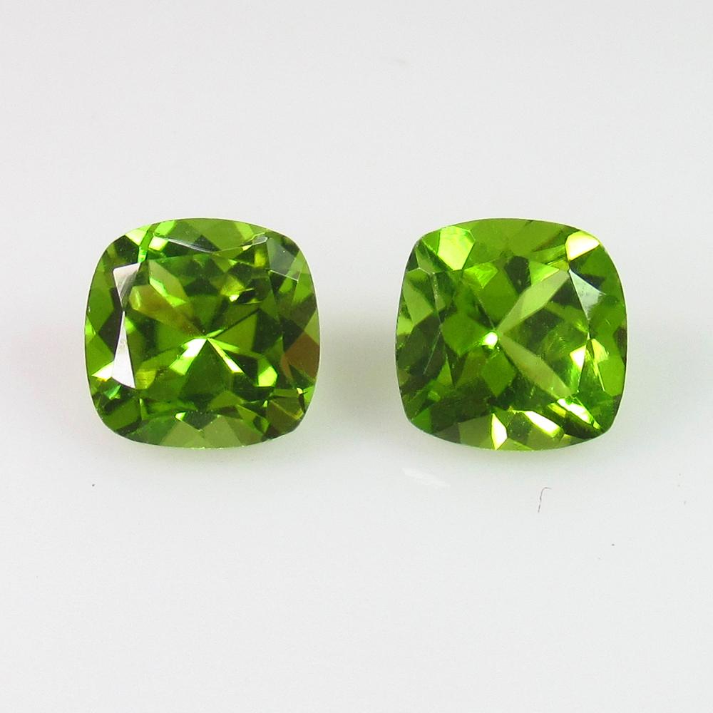 3.02 Ct Genuine Pakistan Peridot Cushion Pair: No Reserve! Title: 3.02 Ct Genuine Pakistan Peridot Cushion Pair Stone Clarity: VVS Gemstones: Natural Peridot Carat Weights: 3.02 Size/Dimensions: 7.00 x 7.00 x 4.50 mm / 2 PC's Additional Informatio