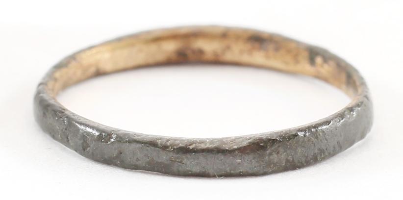 VIKING WOMAN’S WEDDING RING, 866-1067 AD, S6 1/4.: No Reserve! Copper, originally gilt, size 6 ¼. 1.8mm, width low rounded face. The use of pure copper is rare and suggests a supernatural significance as alloys were much more durable. Fine patina and