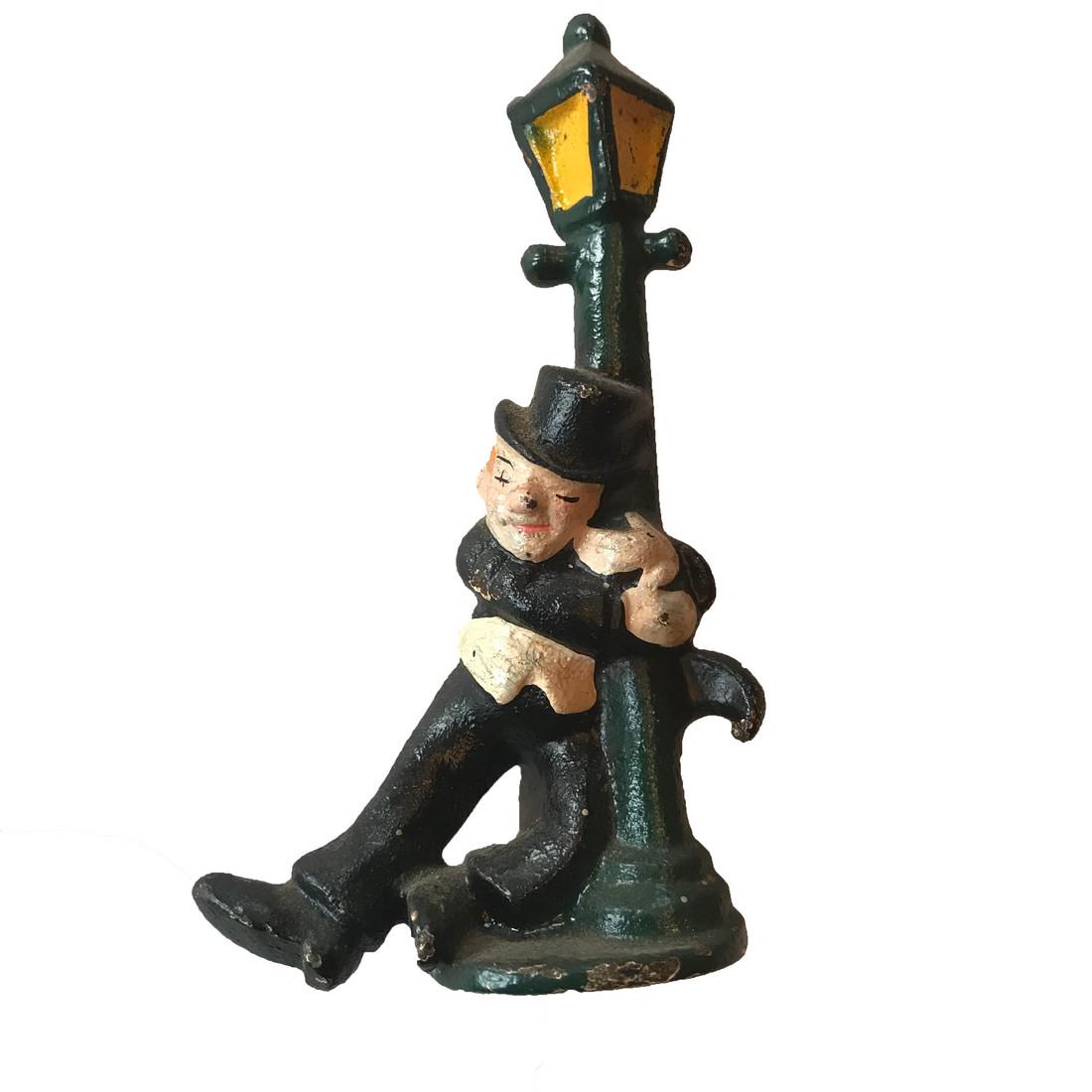 Street Lamp: Title: Street Lamp Dimension: 4” tall Provenance:A bottle cap opener with a tipsy individual. The opener is cast iron with original paint. Ca. 1920 Shipping: Domestic: Flat-rate of $15.00 to anywher