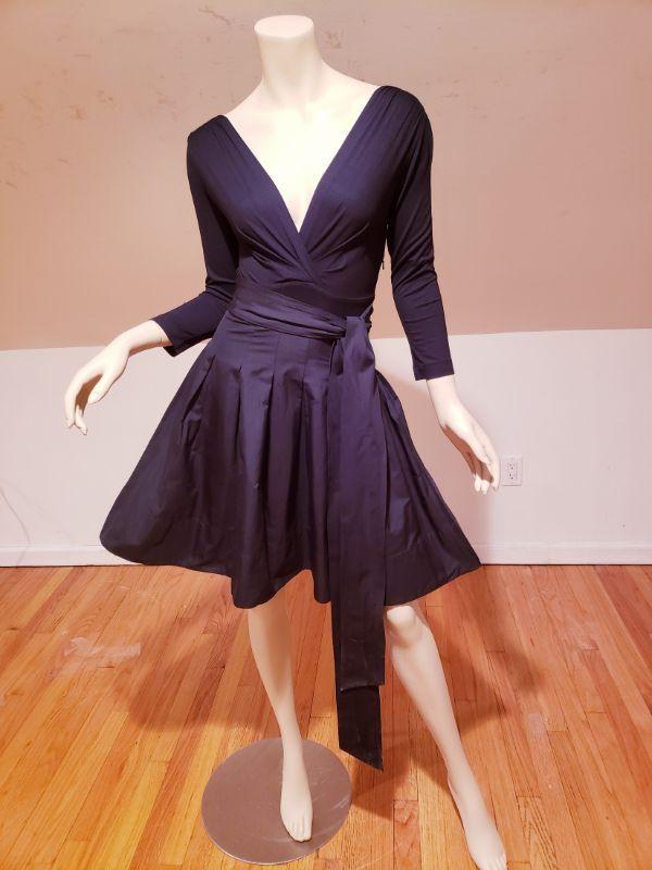Vtg DKNY Donna Karan NY Mixed media Fit & Flare tie: Stunning Fit & Flare dress deep V neckline, 3/4 sleeves, jersey bodice, wrap around tie waist, pleated Faille skirt, slash pockets, V back concealed size zip closure. Very good vintage condition. Bust