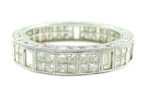 14k White Gold Princess Cut Diamond Band: NS G00 14k white gold princess and baguette cut diamond band There are 5 baguette cut diamonds, and the rest are princess cut (4 per each square setting). Features beautiful filigree work on top