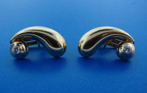 WOW Tiffany & Co. Retro 14k Yellow Gold & Diamond Clip: DK Tiffany & Co. 14k Yellow Gold & Diamond Earrings Circa 1940s · The weight is 7.7 grams. · The length is 7/8 of an inch. The width is ¼ of an inch. There is 0.30 points of round brilliant cut