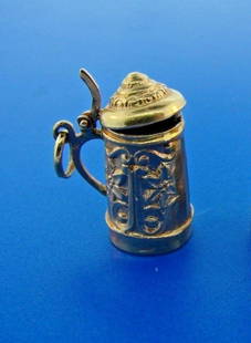 HOORAH Beer Stein 18k Yellow Gold Mechanical Charm: DK Beer Stein 18k Yellow Gold Mechanical Charm · The weight is 4 grams. · The height is 1 inch. The width is 3/8 of an inch. · This is in great condition. Reserve: $420.00 