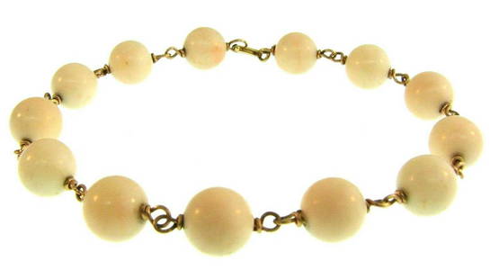 CHIC 14k Yellow Gold & Angel Skin Coral Bracelet: DK 14k Yellow Gold & Angel Skin Coral Bead Bracelet · This is a must for a collector! The weight is 17.1 grams. The length is 8 ½ inches. The width of coral beads is 3/8 of an inch. Reserve: