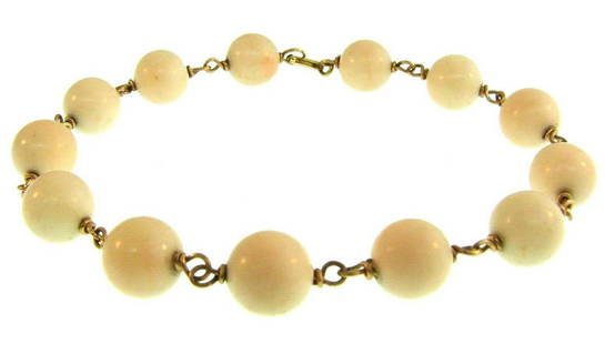 CHIC 14k Yellow Gold & Angel Skin Coral Bracelet: DK 14k Yellow Gold & Angel Skin Coral Bead Bracelet · This is a must for a collector! The weight is 17.1 grams. The length is 8 ½ inches. The width of coral beads is 3/8 of an inch. Reserve: $413.00