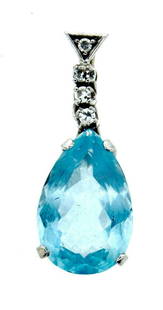 GORGEOUS 18k White Gold, Diamond & Blue Topaz Pendant!: DK 18k White Gold, Diamond & Blue Topaz Pendant! This wonderful pendant is one of a kind! The weight is 3.7 grams. The height is 1 1/8 inches. The length is 3/8 of an inch. The width is 5/16 of