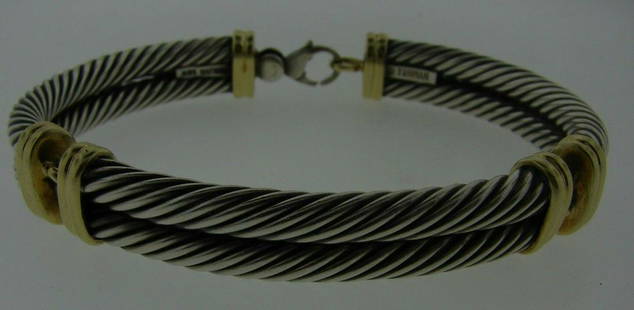 TRENDY David Yurman 14k Yellow Gold & Sterling Silver: DK David Yurman 14k Yellow Gold & Sterling Silver Unisex Bracelet · Wonderful bracelet that is a necessity in your collection. · The weight in total is 53.3 grams. · The length is 8.24 inches.
