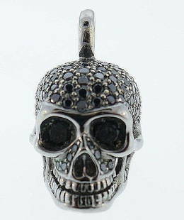 18k Blackened Gold Black Diamond CADA Schmuck Skull: NS N00 18k Blackened Gold Black Diamond Skull Pendant. Made by CADA Schmuck, a German brand from Munich Measurements: Height is 0.5 inch Weight is 6.9 grams In excellent condition; wear consistent