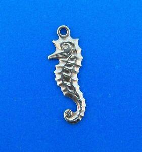 CUTE 14k Yellow Gold Seahorse Charm: DK 14k Yellow Gold Seahorse Charm · Wonderful charm that is a necessity in your collection. · The weight in total is 1.6 grams. · The length is 1 inch. The width is 1/16 of an inch. · This