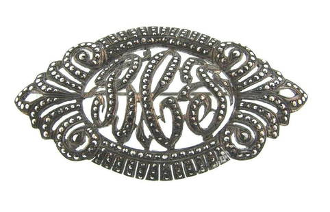 STUNNING Sterling Silver & Marcasite Brooch: DK Sterling Silver & Marcasite Brooch · Wonderful brooch that is a necessity in your collection. · The weight is 12.7 grams. · The length is 2 3/8 inches. The height is 1 ¼ inches. The width