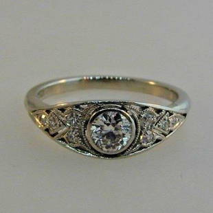 CLASSIC Tiffany & Co. Platinum & Diamond Engagement: DK Tiffany & Co. Platinum & Diamond Ring · This is a must for a collector! The center stone is old European cut weighing 0.40 points. The color is J-K, the clarity is VS1. The surrounding stones