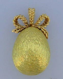 Vintage 18k Yellow Gold Egg Shape Engraved Pendant: NS T00 An iconic egg shape vintage pendant The top part is made of 14k and the body is 18k yellow gold Engraved texture makes the pendant look shiny and remarkable Measurements: 1 1/2 " H x 2/3" W 