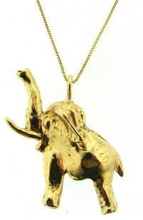 CHARMING 14k Yellow Gold Elephant Necklace: DK 14k Yellow Gold Elephant Necklace · Wonderful necklace that is a necessity in your collection. · The weight in total is 18.1 grams. · The length of the elephant is 17/8 inches. The