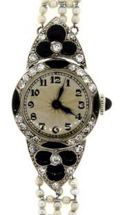 STUNNING Edwardian Onyx, Diamond & Fresh Water Pearl: DK Edwardian Diamond, Onyx & Fresh Water Pearl Watch Circa 1910! This wonderful watch is one of a kind! The weight is 15 grams. There are 0.84 points of single cut diamonds. The length is 6 ½