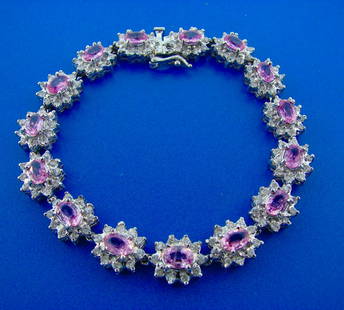 14k White Gold 1.80 Ct Diamond 6.87 Carats Pink: AK IT00 14k White Gold 1.80 Carats Diamond and 6.87 Carats Pink Sapphire Flower Cluster Bracelet · Wonderful bracelet that is a great addition to your collection. · Weight is 25.7 grams · Made