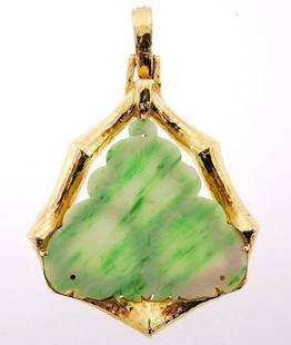 David Webb 18k Yellow Gold Jade Pendant: NS UT00 Beautiful 18k yellow gold jade pendant from David Webb The design perfectly combines a shiny and whimsical yellow gold frame with a delicate jade stone The jade is engraved with a flower-ish