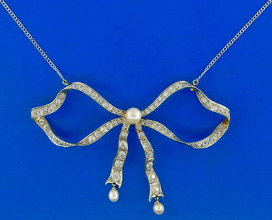 Edwardian Platinum 14k Gold Diamond Natural Pearl: AK NT00 Edwardian Platinum 14k Gold Diamond Natural Pearl Mechanical Bow Pendant Necklace · Wonderful necklace that is a great addition to your collection. · Weight is 17.9 grams · Made of 14k