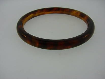 BROWN UNIQUE TRANSLUCENT RARE BANGLE BRACELET VINTAGE: N-JOO GORGEOUS UNIQUE BANGLE WEIGHT 14.3 G WIDTH 5/16'' LENGTH 8'' DIAMETER 2 1/2'' INNER DIAMETER 3 1/8'' OUTER It will enhance the jewelry collection of any fashionista and at the same time is