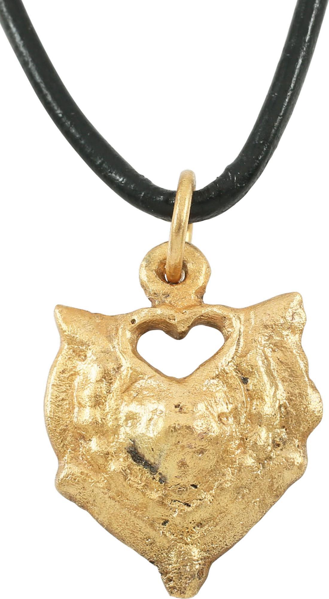 FINE VIKING HEART PENDANT 900-1050 AD.: Just under 1” height, with nubs at the sixth points. Flat rounded edge. Central heart with a beaded border. The form of the heart is natural as in the body rather than stylized with the top cusp. Bo