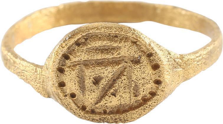 VIKING TALASMANIC RING, 7TH-10TH CENTURTY AD: Size 9 ½. 2.2mm rounded face band supporting an oval bezel with inset dot border. Central geometric figure with dots and dashes. Probably a representation of an astrological figure which were sacred 