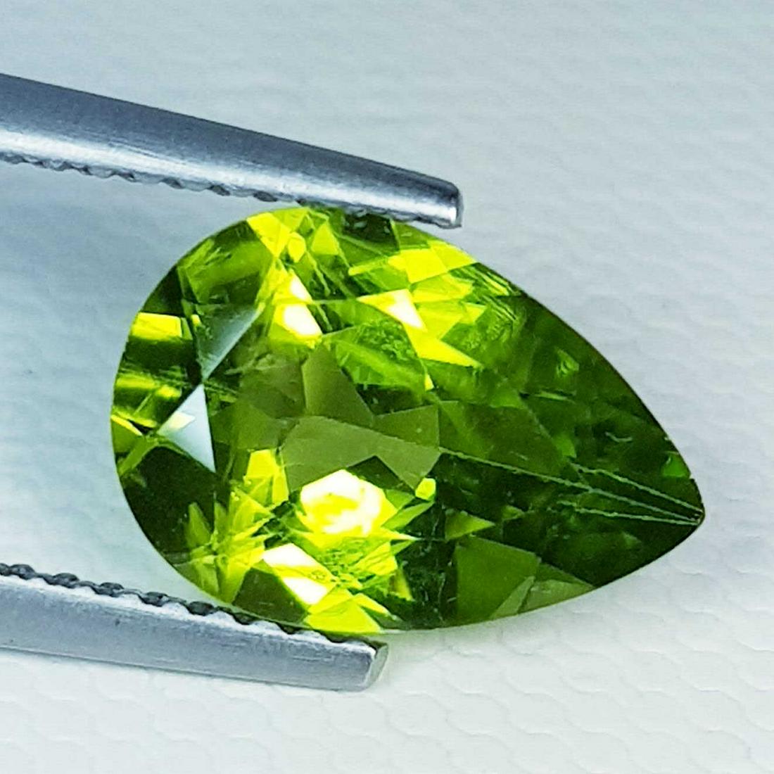 2.63 ct Natural Peridot Pear Cut: No Reserve! Title: 2.63 ct Natural Peridot Pear Cut Color/Clarity: VVS Loosegemstone Carat Weights: 2.63 Size/Dimensions: 11.20 x 7.80 x 4.70 Pear - Pakistan Shipping: Worldwide: Flat-rate of $10.00 t