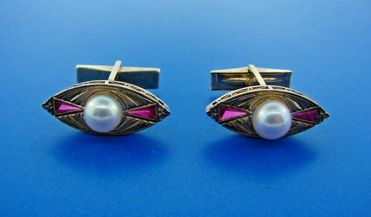 LUXURIOUS 14k Yellow Gold, Pearl & Ruby Cufflinks: DK 14k Yellow Gold, Ruby & Pearl Cufflinks · This is a must for any collector. · The weight is 10.6 grams. · The length is 1 inch. The pearl mm is 7.93. Reserve: $455.00 Shipping:Domestic: