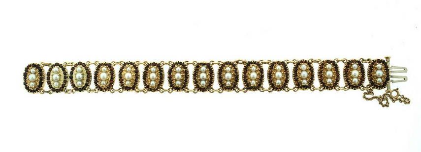 C.1950 VINTAGE 14K YELLOW GOLD GARNET PEARL BRACELET: N-JUOO VINTAGE C.1950 14K YELLOW GOLD PEARL GARNET BRACELET WEIGHT - 31.0 G LENGTH - 6 3/4'' WIDTH - 9/16'' STAMPED: 14K Reserve: $1,820.00 Shipping:Domestic: Free shipping to anywhere within