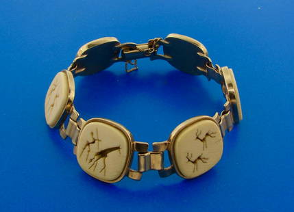 Antique South African Carved Stone 9k Yellow Gold: AK GT0 South African Carved Stone 9k Yellow Gold Hunting Motif Bracelet · Wonderful bracelet that is a great addition to your collection. · Weight is 31.9 grams · Made of 9k Yellow Gold