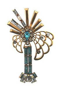 CHIC Phyllis 12k Gold Filled & Colored Glass Brooch: DK Phyllis 12k Gold Filled & Glass Brooch · Wonderful brooch that is a necessity in your collection. · The weight is 7.4 grams. · The length is 2 5/8 inches. The width is ¼ of an inch. ·
