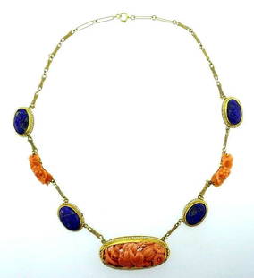Antique 14k Yellow Gold Carved Lapis Coral Pearl: NS JNT0 Antique 14k yellow gold necklace features carved lapis and coral with natural seed pearl Measurements: 16 1/2" L x 2/3" W (the widest part) Weight is 28.0 grams In excellent condition;