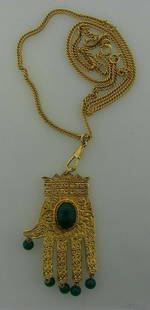 GORGEOUS Gold Plated & Malachite Hamsa Hand Necklace: DK Gold Plated & Malachite Hamsa Hand Necklace · Wonderful necklace that is a necessity in your collection. · The weight is 70.9 grams. · The length of the chain is 28 ½ inches. The length of