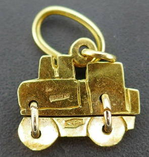 Vintage 18k Yellow Gold Locomotive Charm: NS GT Adorable vintage 18k yellow gold locomotive charm A remarkable addition to your charm bracelet Stamped with a hallmark for 14k gold and a serial number. Measurements: 2/3" H (including a