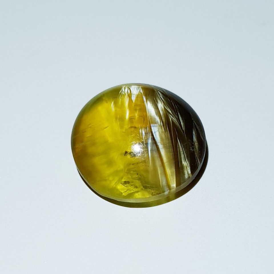 3.00 ct Natural Opal Cat's Eye: No Reserve! Title: 3.00 ct Natural Opal Cat's Eye Color/Clarity: Semi Transparent Loosegemstone Carat Weights: $3 Size/Dimensions: 10.90 x 10.90 x 4.70 Additional Information: Round - Africa Shipping: