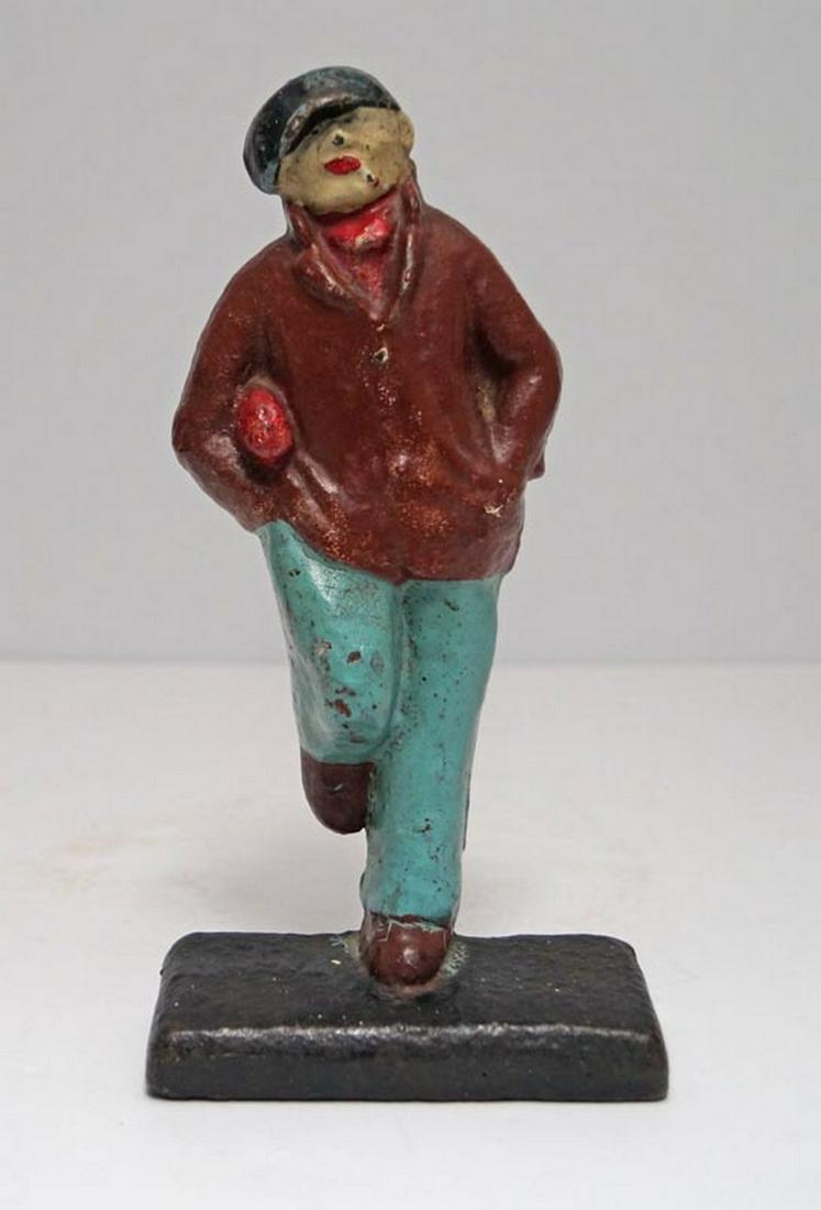 Antique Rugby Player Football Cast Iron Doorstop: Title: Date/Period: Circa 1920’s Dimension: 8 3/4" tall x 4 1/8" wide Provenance:A RARE and DESIRABLE Rugby Football Player holding Football Doorstop. Superb casting surface & patina. Shipping: Dome