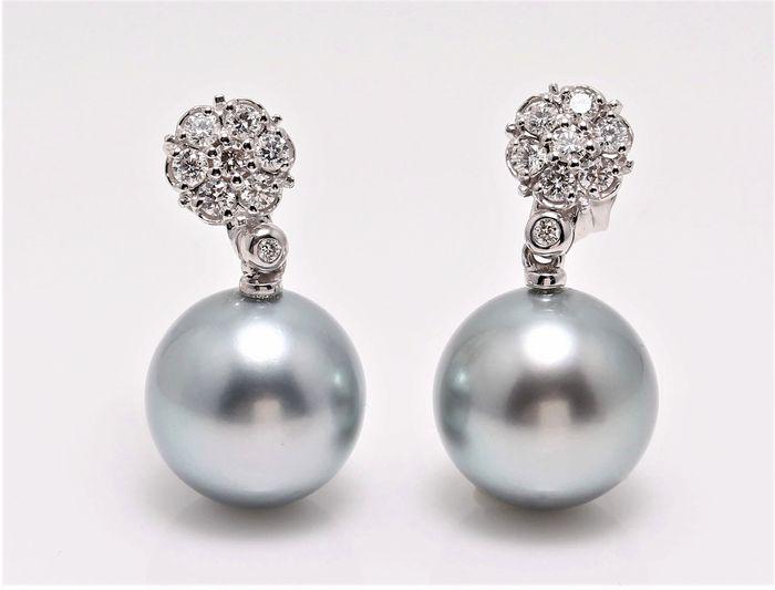 14 kt. White Gold - 12x13mm Round Tahitian Pearls -: Exclusive Diamond and Pearl Earrings in 14K White Gold, can be worn in two ways: either as diamond studs with jackets removed, or with the pearl jackets as diamond pearl earrings. Emerging from the tr