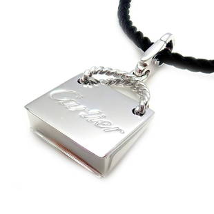 Cartier 18k White Gold Shopping Bag Charm Silk Pendant: Authentic! Cartier 18k White Gold Shopping Bag Charm Silk Pendant Necklace You are bidding on an Authentic! Cartier 18k White Gold Shopping Bag Charm Silk Pendant Necklace More About the Piece: 