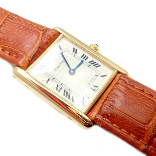 Cartier Tank 18k Yellow Gold Unisex Quartz Watch: Authentic! Cartier Tank 18k Yellow Gold Unisex Quartz Watch You are bidding on an Authentic! Cartier Tank 18k Yellow Gold Unisex Quartz Watch Works great, fully functional. More About the Piece: 